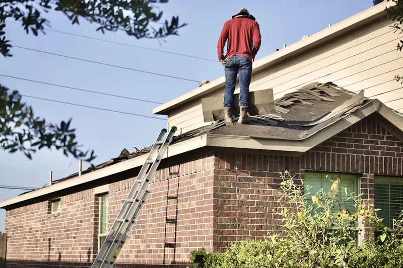 Professional roofer working on a residential roof in Taneytown
